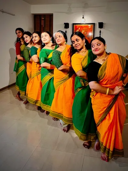 A playful, posed shot of our ensemble before a performance, showing the camaraderie and excitement we share.