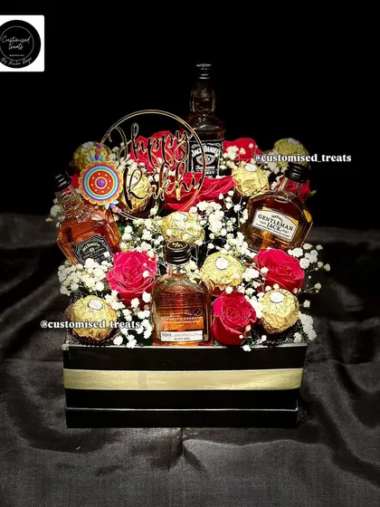 For the brother who appreciates the finer things. This premium hamper combines his favorite miniature spirits with decadent chocolates and fresh flowers for a sophisticated and memorable Rakhi gift.
