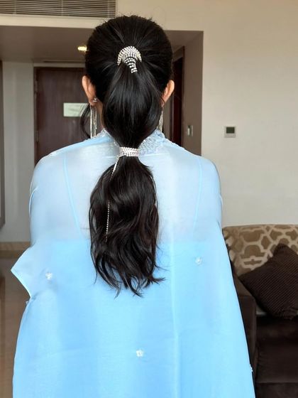 Another back view of the stylish bubble ponytail, a trendy and sophisticated choice for any modern event.