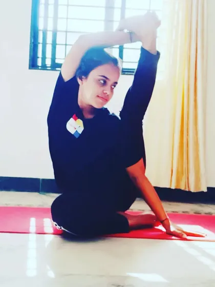 A seated pose demonstrating deep hip and shoulder flexibility. Sometimes it's better to wait for the body to be ready than to force things, and this is especially true in advanced stretching.