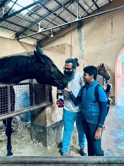 A young rider and his father share a special moment with his new horse, Dreamboy. I believe in involving the entire family in the equestrian journey.