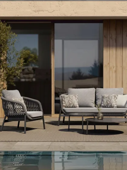 This outdoor furniture set from Cairo showcases a sophisticated and modern design. The woven detail on the chairs and the neutral grey palette make it a versatile choice for any patio or poolside.