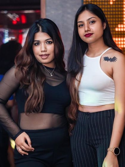 More guests looking glamorous at The Fixx Bar. The crowd's energy is a huge part of the experience.