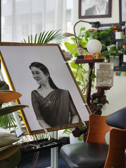 The portrait on my easel in my studio, giving a sense of the creative environment where your memories are turned into art.