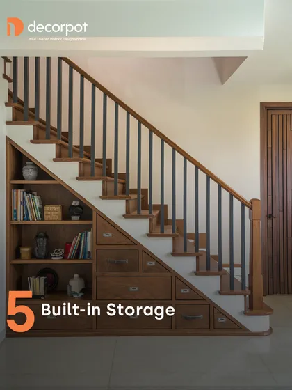I believe every inch of a home has potential. This custom-built unit transforms the often-wasted space under a staircase into a functional and stylish storage solution with a mix of drawers and bookshelves.