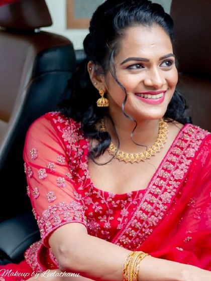 A beautiful, happy client on her engagement day, captured in a candid moment. The makeup is designed to look fresh and natural, even on the go.