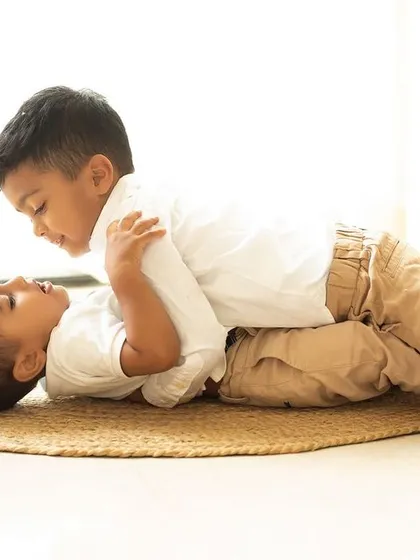 Brothers in arms, quite literally! Capturing the playful wrestling and fun that defines the relationship between these two brothers.