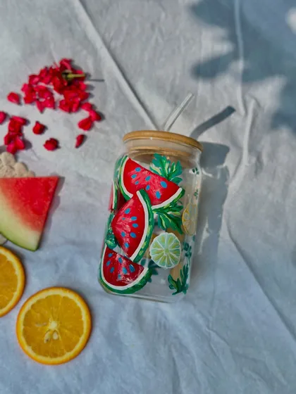 A single watermelon-themed sipper jar, styled with fresh fruit. It perfectly captures the feeling of a sunny summer day.