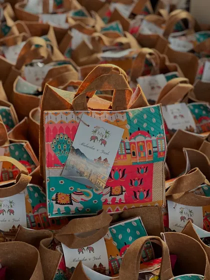 There's nothing like a warm welcome at a destination wedding. I created hundreds of these vibrant, Rajasthani-themed jute bags filled with snacks and goodies to welcome guests. It’s the perfect way to get the celebration started.