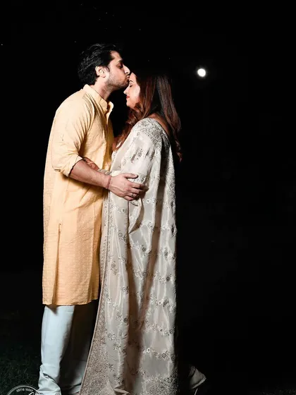An intimate moment from a Karwa Chauth festival shoot. Using the soft moonlight and minimal artificial light, I captured the romance and tenderness of the couple as they celebrated their bond. This type of low light photography creates a dramatic and emotional feel.