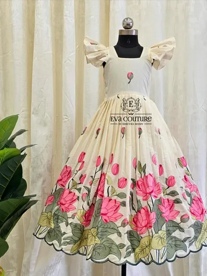 I also design elegant one-piece frocks. This beautiful piece is made from a soft, off-white fabric featuring a lovely pink lotus print, perfect for a modern yet traditional look.