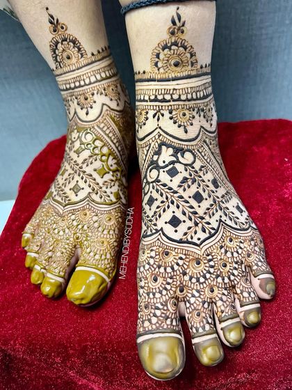 A slightly different angle of the full-coverage foot mehendi, showing the beautiful contrast of the henna.