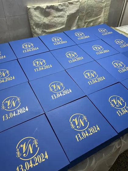 A full set of our customized Roka return favor boxes, ready to be gifted. The bold blue and gold combination makes a stunning impression.