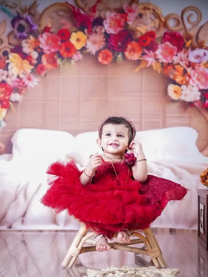 Seated on a small stool, the birthday girl looks absolutely adorable in our colorful and trendy boho-themed set.