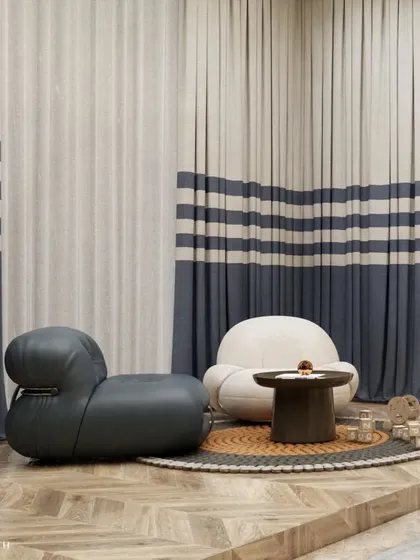 A close-up of the play area, featuring soft, rounded chairs and a small table on a textured rug. We focus on using child-safe furniture and creating comfortable nooks for imaginative play.