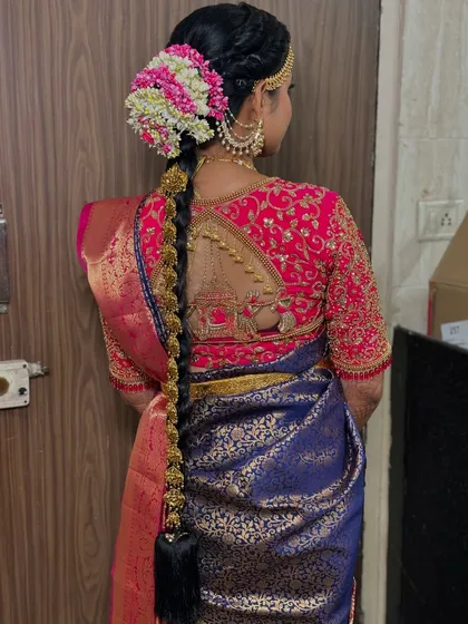 It's all in the details. This traditional South Indian bridal braid, complete with fresh flowers and intricate gold accessories, is a masterpiece in itself and a core part of the complete bridal look I provide.