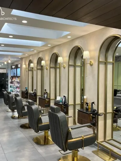 The main styling floor at Bella Madonna, where we used a series of arched mirrors and wall sconces to create a classic and elegant atmosphere. The layout is designed for efficient workflow while ensuring each client has a personal and comfortable space.