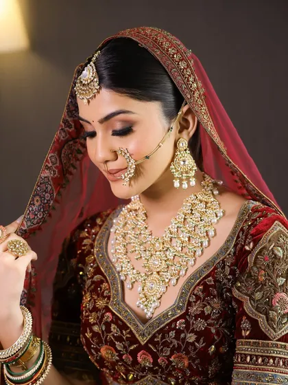 The final look, with the dupatta perfectly set. This image captures the complete elegance of a traditional Indian bride, ready for her ceremony.