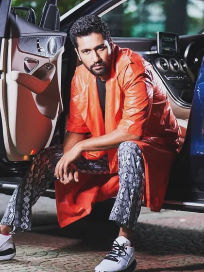 Another look from my shoot with Vicky Kaushal. This striking orange leather jacket paired with snakeskin print pants was a powerful, high-fashion statement that he pulled off effortlessly.