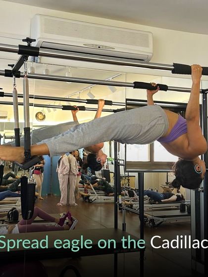 The Spread Eagle on the Cadillac. A beautiful exercise that channels your inner eagle, soaring to new heights with every stretch.