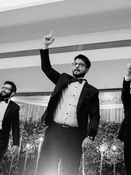 A classic boy band pose. We choreograph fun and cool moves for the groomsmen that are easy to learn and look great in photos.