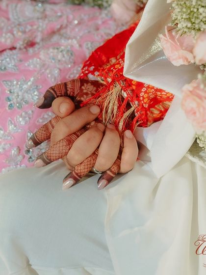 The sacred 'gathbandhan' knot, tying the couple together as they embark on their new journey. We ensure even the smallest rituals are captured beautifully.