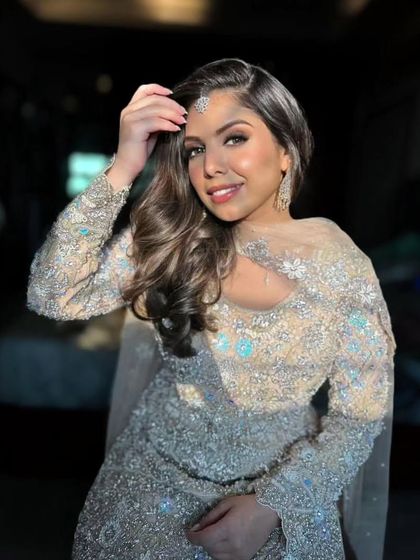 This shot captures the beautiful interplay of light on the skin and the embellished outfit. The makeup is designed to catch the light perfectly, adding a touch of magic and dimension to the final photos.