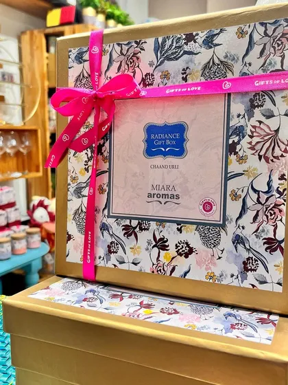 Our 'Radiance' gift box, featuring Chaand Urli candles, is another beautiful option for Diwali. The box is adorned with our custom floral print and tied with a satin ribbon.