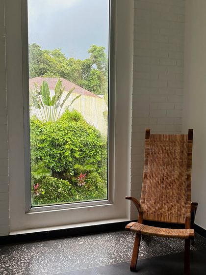 A quiet corner with a view of the lush greenery in Goa. This photo captures the peaceful, serene side of a vacation, a perfect moment of calm.