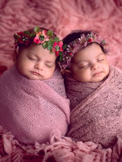 A close-up of these two angels. The soft, fluffy rug and cozy wraps keep them warm and snuggly during their twin newborn session.