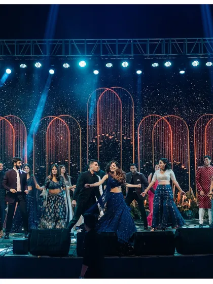 The entire family joins the couple on stage for a massive group performance, a perfect finale to the Sangeet night.