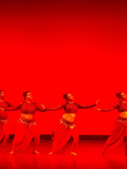 Another powerful shot of our team on stage. The combination of dramatic lighting, coordinated costumes, and precise choreography is how we create unforgettable event entertainment.
