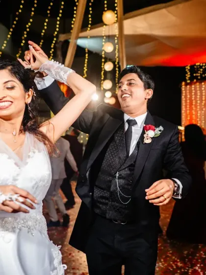 The bride and groom enjoying their first dance as a married couple. The smiles on their faces show their pure happiness.