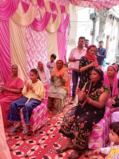 The audience at our community event, fully engaged and participating in the celebration. I make it a point to create an inclusive atmosphere where women, children, and youth all feel like a part of the occasion.