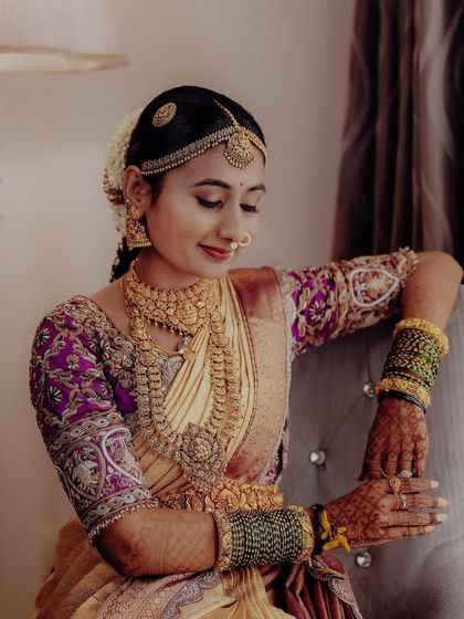 It was a joy to bring Jahnvi's dream engagement attire to life. I paired her beautiful Kanchipuram saree with a custom blouse featuring intricate handwork on the sleeves and added a flowing veil for a princess-like charm.