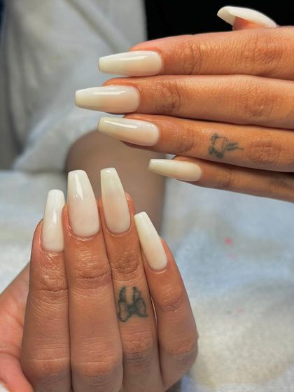 Simplicity meets elegance with these milky white Gel-X nails. This semi-sheer white provides a clean, fresh, and modern look on long, coffin-shaped nails.