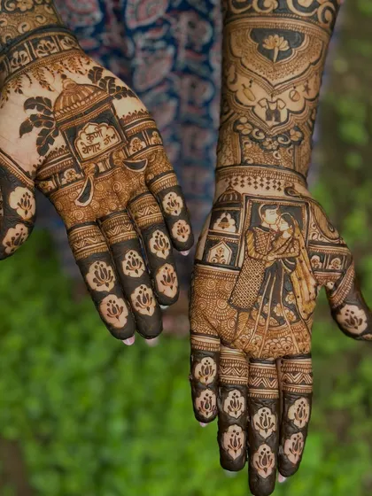 The complete design, with a couple portrait on one hand and a traditional temple motif on the other, symbolizing blessings for their growing family.