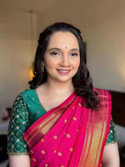 A beautiful, happy portrait. This look is perfect for any traditional ceremony, providing an elegant and respectful enhancement of her natural beauty.