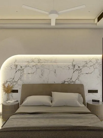 The full view of the rendered bedroom, showing how the curved marble headboard becomes the centerpiece, complemented by soft, neutral tones and a plush armchair.