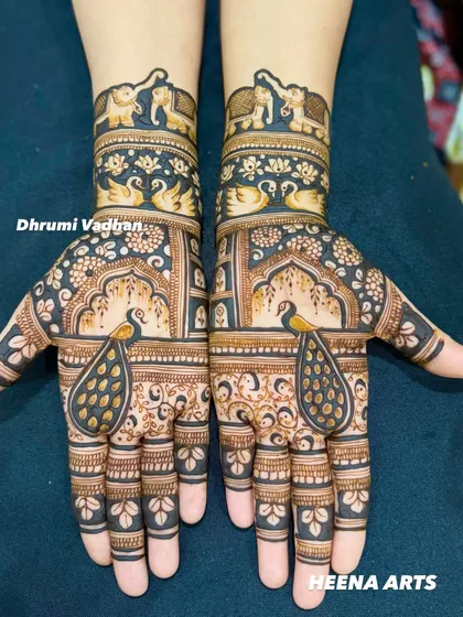 I love blending classic Indian motifs into my bridal designs. This full hand mehendi features graceful peacocks, majestic elephants, and delicate swans, creating a timeless and elegant look for the traditional bride.