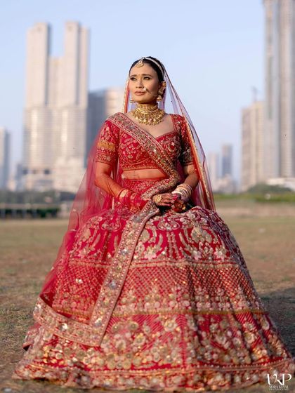 A regal pose from our stunning bride. The entire look, from the intricate lehenga to the soft, glowing makeup, came together to create a vision of modern royalty.
