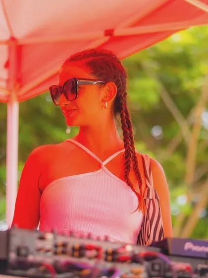 A DJ at the console during the Colour Splash 2024 event. We provide professional setups for our artists in any outdoor setting.