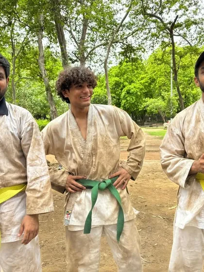Three of our students after a tough outdoor belt test. The dirt on their gis is a sign of hard work and a great training session.