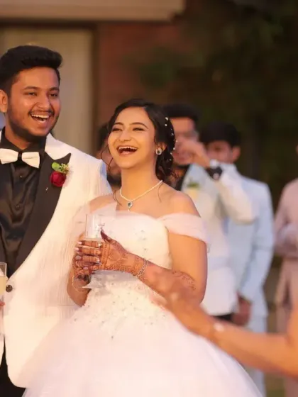 A candid moment of laughter and joy during the wedding reception. This shows that my makeup for Christian weddings is not only beautiful but also durable enough to last through the entire celebration.