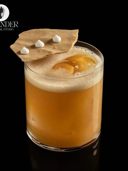 The Tropical Sour, made with Bourbon, Aperol, passionfruit, and citrus. A complex and delicious cocktail for the discerning palate.