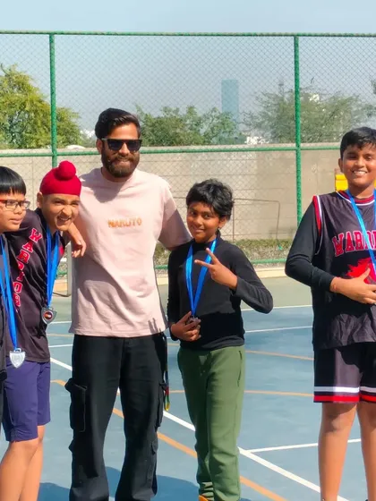 Celebrating with a team after a hard-fought series of Inter-Society basketball matches. The medals are a testament to their effort and teamwork on the court.