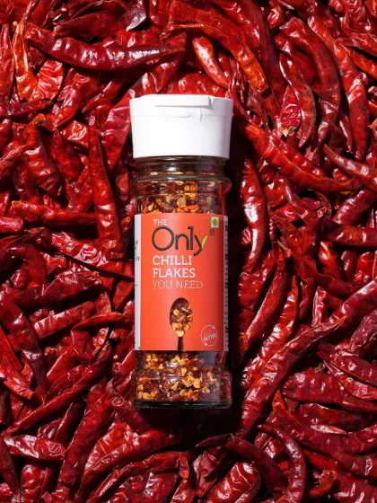 A product shot should be bold and vibrant. We used a bed of whole red chillies to create a powerful, textured background that makes this bottle of chilli flakes pop, instantly communicating its fiery flavour.