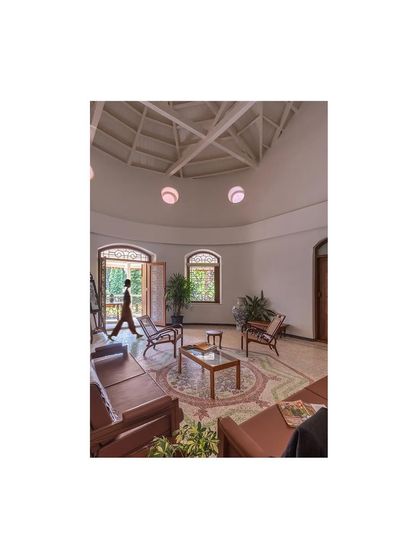 A dynamic view of the central living space, showing how we reconfigured the layout for modern functionality while respecting the historical integrity and scale of the original architecture.