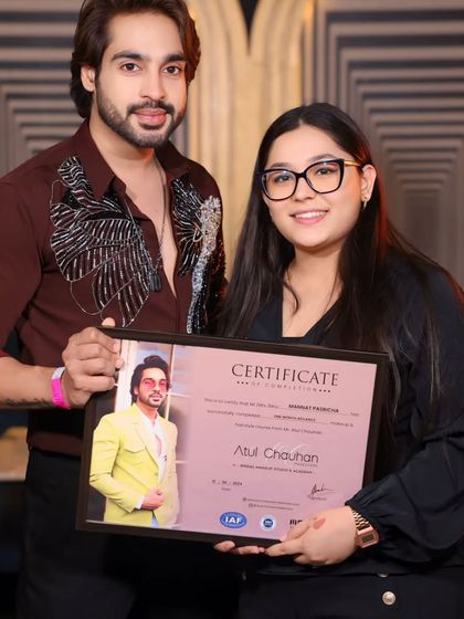 A proud graduate holding her certificate. Her eye for detail is outstanding.