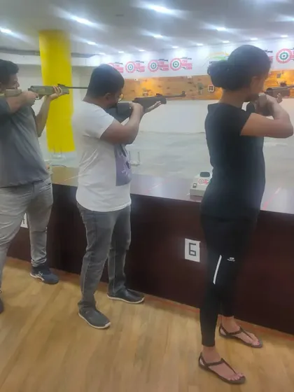 Friends taking aim together during a group session. We ensure everyone gets proper guidance to enjoy their experience safely.